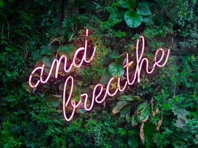 and breathe neon sign on tre